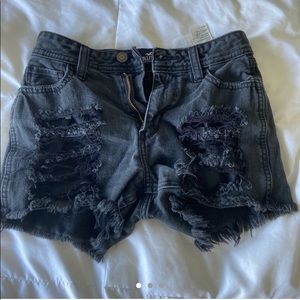 high rise black ripped shorts